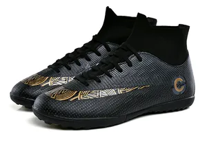 Detailed view of high-top soccer shoes with textured leather and gold graphic patterns