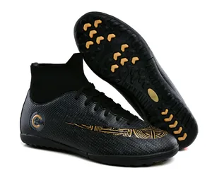 High-top black soccer shoes with gold patterns and durable turf cleats for training
