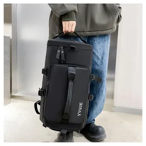 Close-up view of a versatile black travel duffle bag featuring a sturdy vertical handle.