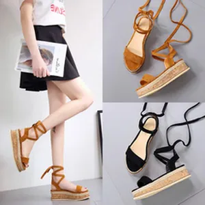 Fashionable women's lace-up wedge sandals in black and brown colors with platform soles