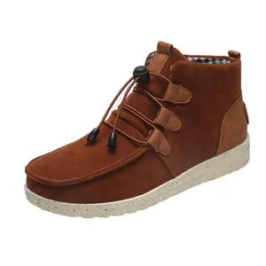 Detailed view of brown suede casual low-cut ankle boots with elastic drawstrings
