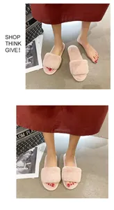 Detailed top and side views of soft pink faux fur slide slippers for indoor wear
