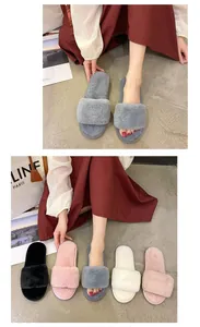 Detailed view of plush faux fur slippers available in pink, grey, black and cream