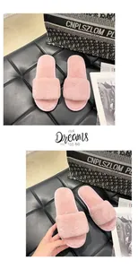 Detail view of plush pink faux fur slippers for cozy winter indoor home wear