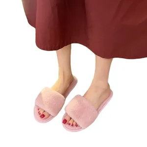 Comfortable pink faux fur one-strap slippers for women, flat warm indoor home footwear.