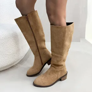 Stylish tan faux suede knee-high boots featuring a low block heel and convenient side zipper