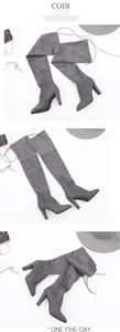 Macro view of grey suede over-the-knee boots with chunky heels and pointed toes