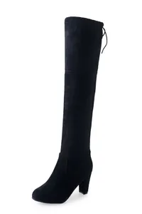 Side view detail of black suede over-the-knee stretch boots with chunky high heels