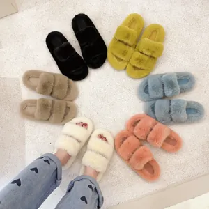 Close-up view of multiple colorful faux fur open-toe slippers arranged in a circle