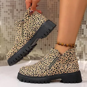 Detailed side view of leopard print Chelsea boots with chunky black lug soles for women