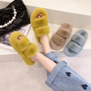 Close-up detail of colorful fuzzy platform slippers with soft faux fur straps in bright hues