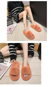 Comfortable orange faux fur slide slippers for indoor lounging and cozy home style.