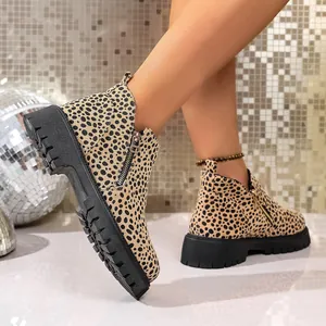 Close-up of fashionable leopard print chunky heel Chelsea boots with side zipper