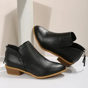 Elegant black pointed toe Chelsea boots with a textured leather finish and rear zipper