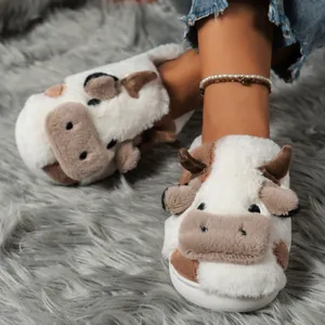 Close-up of plush cow-pattern slippers with cute 3D details and soft faux fur texture