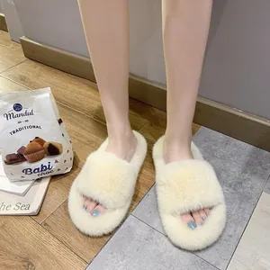 Premium cream fuzzy faux fur slide slippers for women shown in a cozy home setting