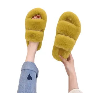 Fashionable yellow fuzzy platform slippers for women designed for indoor and outdoor wear