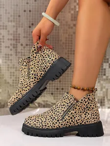 Detail of leopard print Chelsea boots with chunky black sole and side zipper