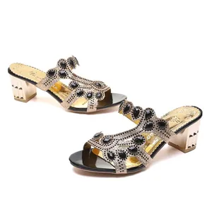 Elegant women's block heel sandals with black rhinestones and gold glitter finish