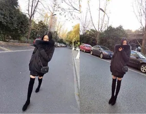 Vista street style di stivali sopra il ginocchio in camoscio nero con punta tonda