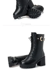 Black lace-up mid-calf boots with chunky high heels and decorative buckle detail