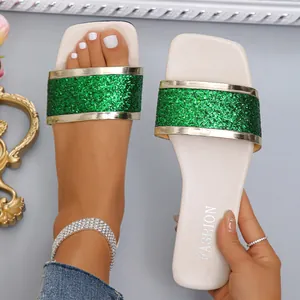Stylish women's square toe flat sandals featuring a vibrant green glitter strap for summer