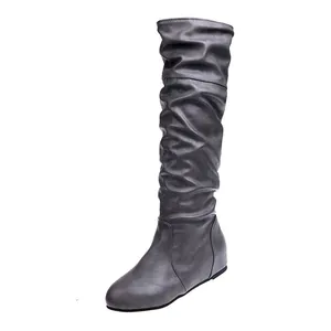 Stylish grey slouchy over-the-knee boots for women with a comfortable flat sole design.