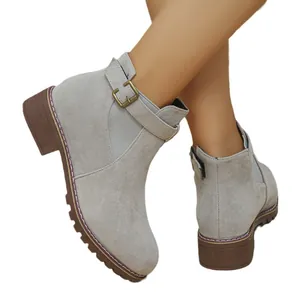 Grey suede ankle boots for women featuring a low block heel and decorative side buckle