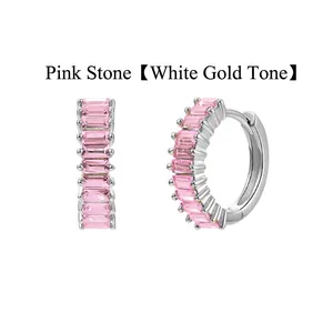 Close-up of pink baguette cubic zirconia stones set in silver-tone huggie hoop earrings