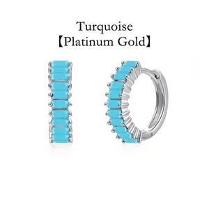 Elegant turquoise baguette stone huggie hoop earrings in white gold plating finish detail view