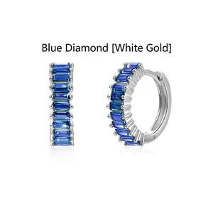 Elegant silver-tone hoop earrings featuring channel-set blue baguette-cut cubic zirconia