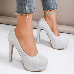 Elegant close-up view of silver glitter stiletto pumps with high platform on a model