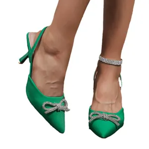 Elegant green pointed-toe high heel sandals with rhinestone bow and slingback strap
