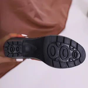 Anti-slip rubber sole detail of black high heel Martin boots for women size 37