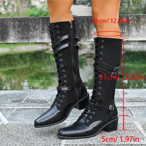 Black lace-up knee-high knight boots for women with buckle straps and block heel.