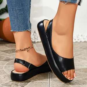 Detail view of black peep-toe platform sandals with comfortable thick soles