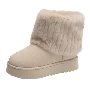 Detailed macro view of beige thick-soled snow boots featuring a plush faux fur collar