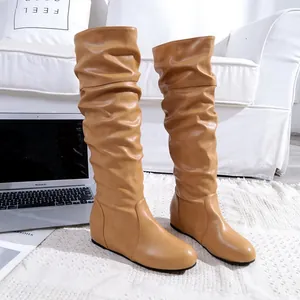 Stylish tan slouchy knee-high boots with round toe and comfortable flat sole design