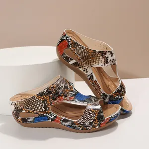 Comfortable women's wedge sandals featuring vibrant snake skin print and floral decor