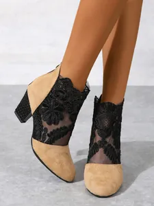 Stylish women's lace mesh high heel boots with chunky heels and elegant round toe design.