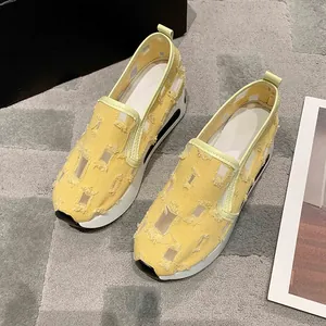 Stylish yellow platform loafers for women featuring a distressed patchwork mesh upper