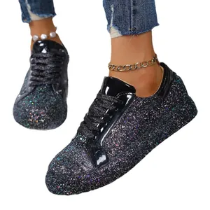 Fashionable black glittery sequined low-top sneakers with lace-up design and flat soles