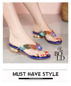 Model wearing Bohemian style rhinestone flip-flops with sparkling multi-colored gems