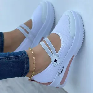 Detailed view of white Mary Jane mesh sneakers featuring decorative star and 'Fashion' print