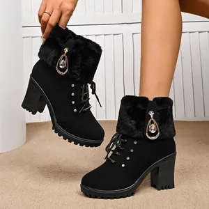 Stylish black heeled Martin boots featuring plush fur trim and elegant crystal drop accents