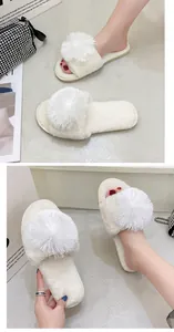 Détail de pantoufles blanches duveteuses à pompon avec bout ouvert et texture douce