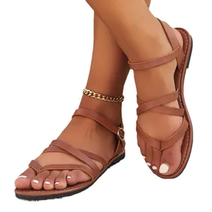 Stylish women's flat gladiator sandals with brown cross straps and secure toe loop design