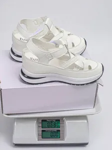 Detailed view showing the 0.68kg weight of the white Roman platform sandals for women