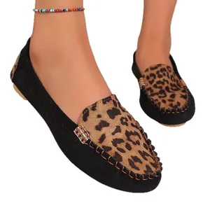 Classic women's flat loafers featuring leopard print vamp and black suede finish