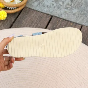 Macro view showing the durable non-slip sole of women's flat denim beach sandals